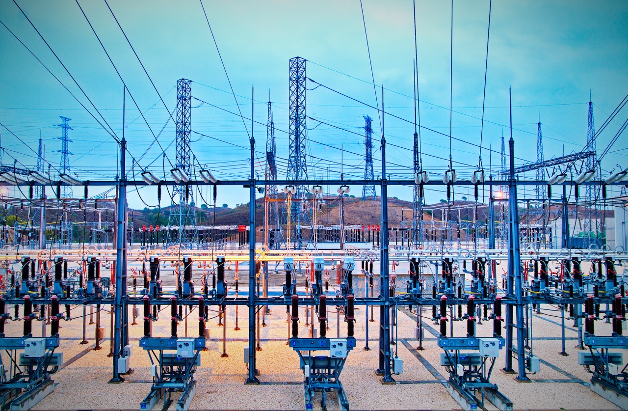 Power station for making Electricity. Shot before sunrise with cable red hot